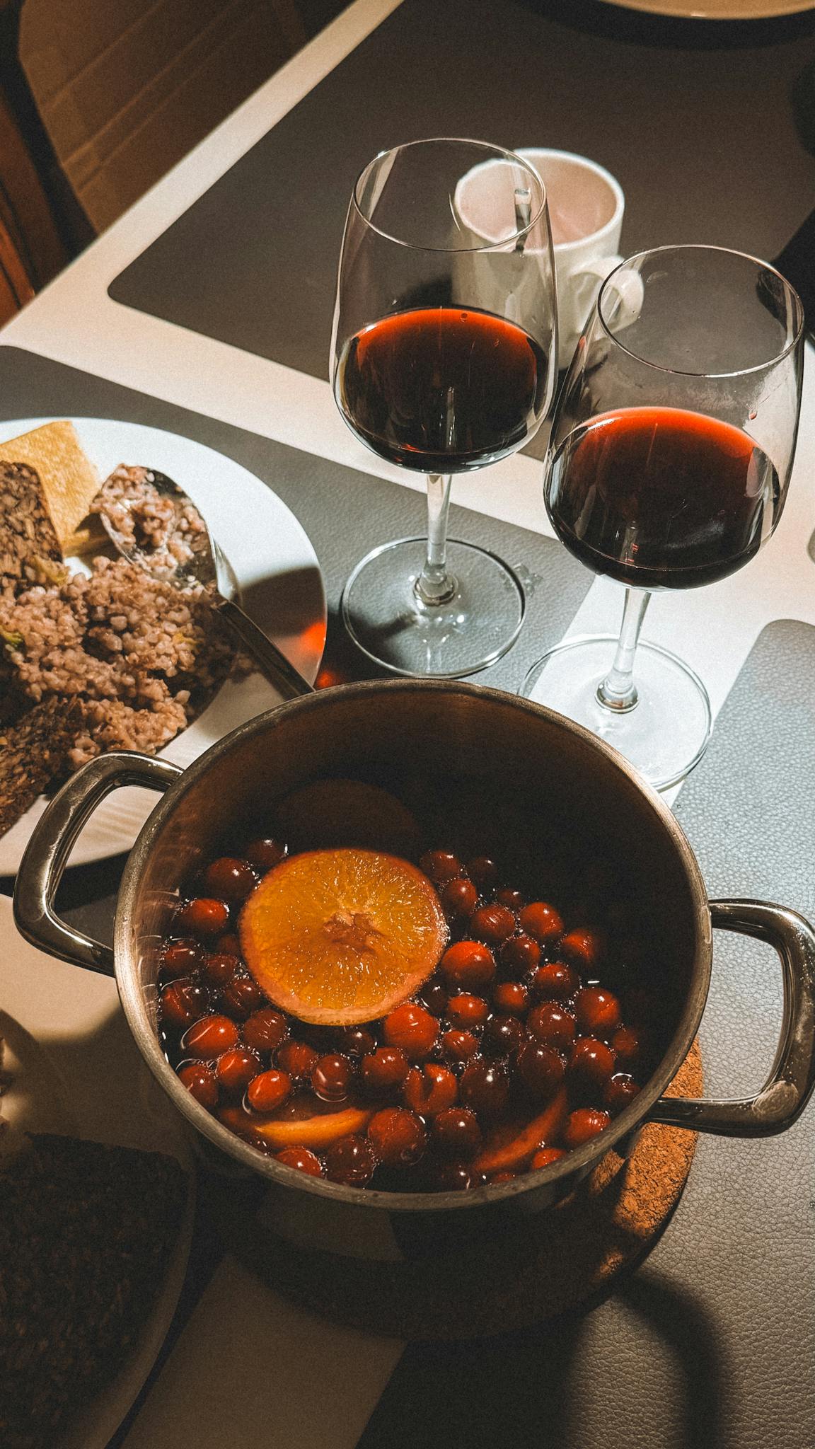 Warm evening setting with mulled wine and snacks, creating a cozy atmosphere for relaxation.