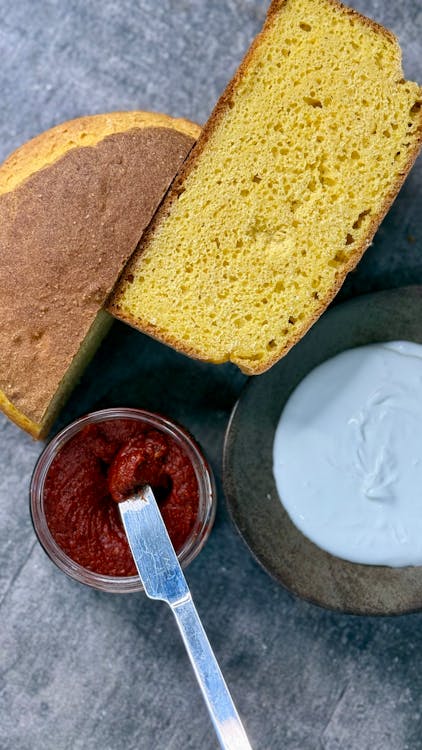 Golden homemade cornbread baked in a cast iron skillet